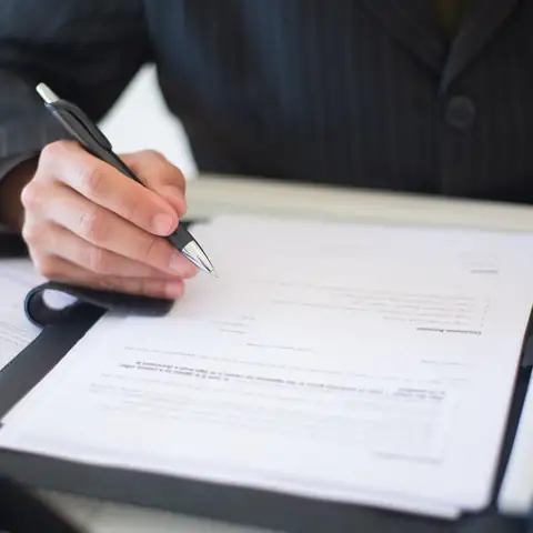 A provider signing an enrollment form