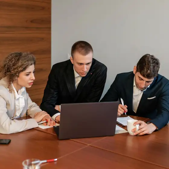 A team training session around a laptop