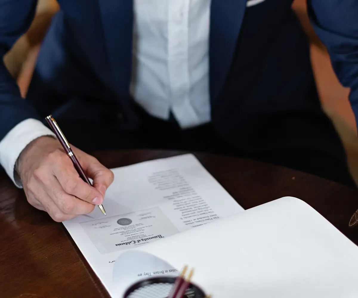 A man signing an authorization form
