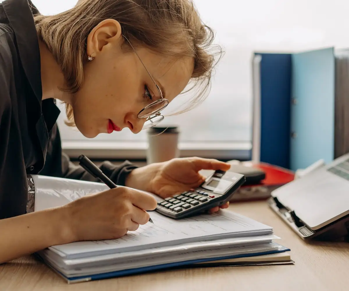 An analyst working through claim papers