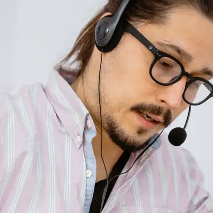 A biller with a headset on a call