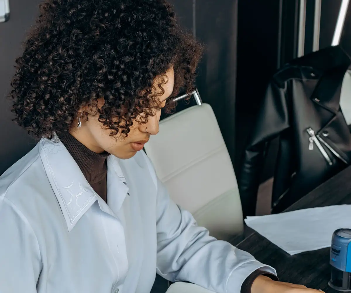 A specialist reconciling payments with a calculator