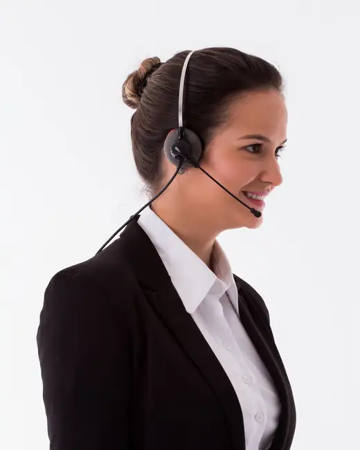 A smiling account manager wearing a headset