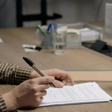 A client signing a service agreement