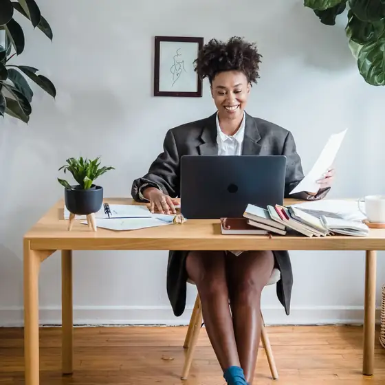 A virtual assistant working at a home office desk